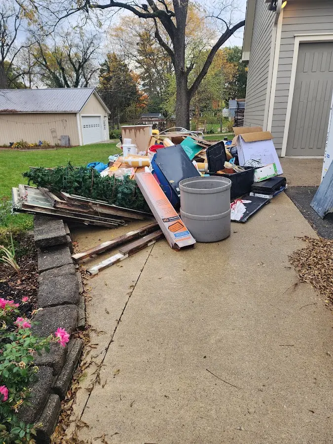 Dumpster being loaded with debris for Estate Cleanout Dumpster Rental in Landover